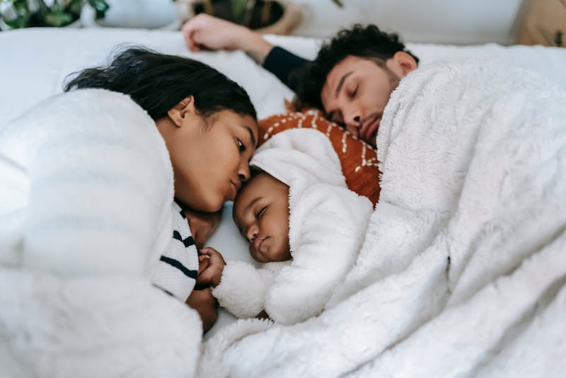 a family feeling comfortable in their bed